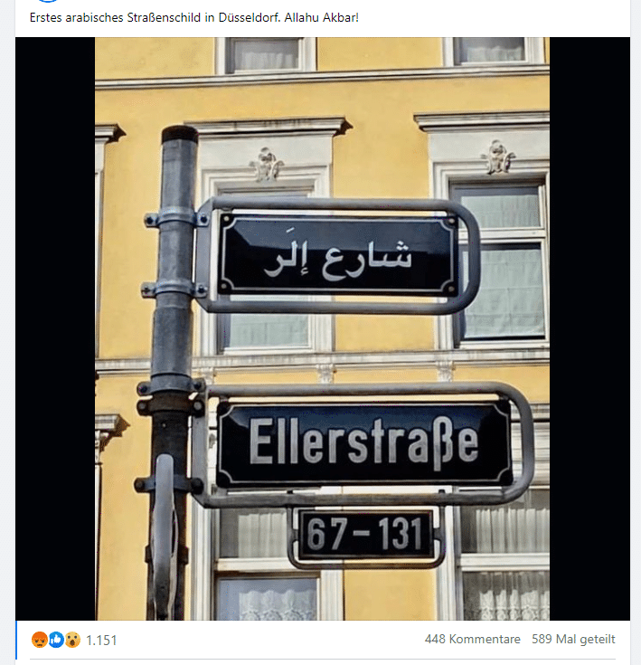 Düsseldorf: Straßenschild in arabischer Schrift überklebt